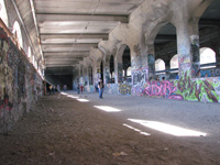 Graffiti decorated walls, and the Cathedral-like arches and windows of the Aqueduct fill with light.