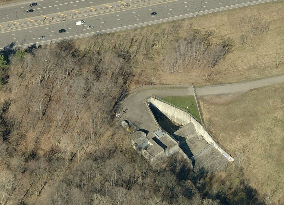 At the top of the photo is Interstate 590. That V-shaped thing is the control structure. At the pointy end of the V is the Culver-Goodman deep rock tunnel opening. And at the wide end of the V is a 50 foot high dam. [PHOTO: RochesterSubway.com]