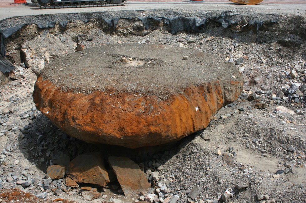 This 'button' of slag was left over from the old Quinnesee Iron mill once located on this site. It's estimated to weigh some 100 tons. [PHOTO: Fred Amato]